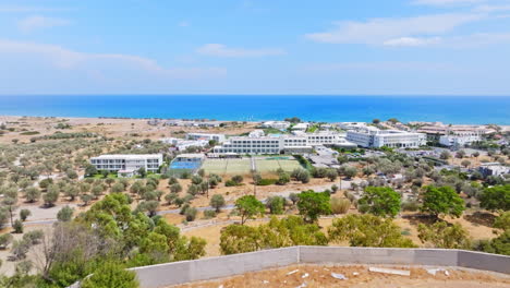 aerial view over hilltop villa project, toward hotels on sunny rhodes, greece