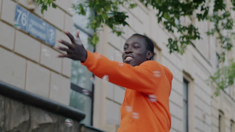 young man playing with bubbles in the city