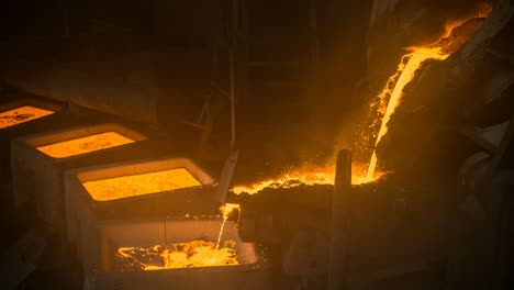 tank pours liquid metal in the molds by carousel machine. cinemagraph.