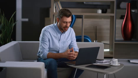 man ceo calling webcam video chat talking colleagues using computer in office.