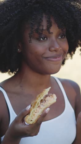 young woman looking at food with surprise and delight