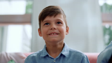 Boy-talking-during-video-game.-Focused-gamer-playing-computer-game-with-gamepad