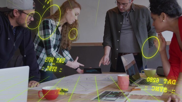 Design team placing hand and moving tablet, activating yellow AR overlay aligning with plan detail