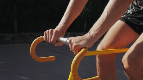 person riding a yellow bicycle