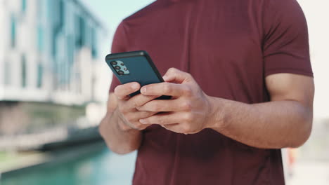 man, phone and hands typing in city for outdoor