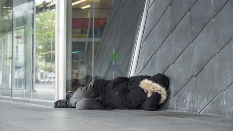 homeless person sleeping on the street