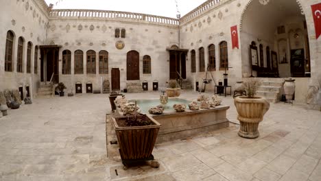 yard of traditional urfa riche house pool with fountain in centre and special place for drink tea