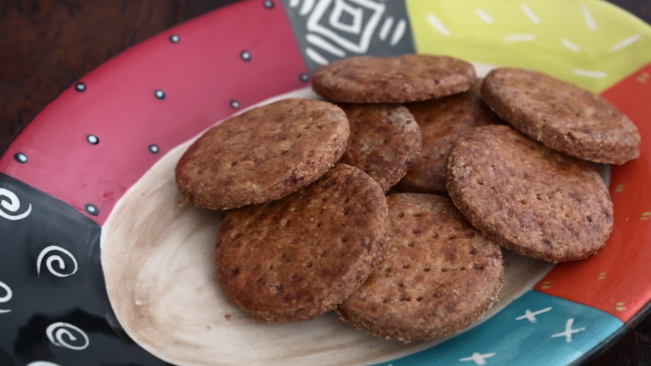 Colorful plate with homemade cookies, dolly shot left to right