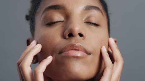 close up portrait gorgeous african american woman gently touching face with hands enjoying smooth healthy skin complexion natural feminine beauty skincare concept