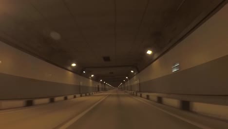 driving through a night tunnel