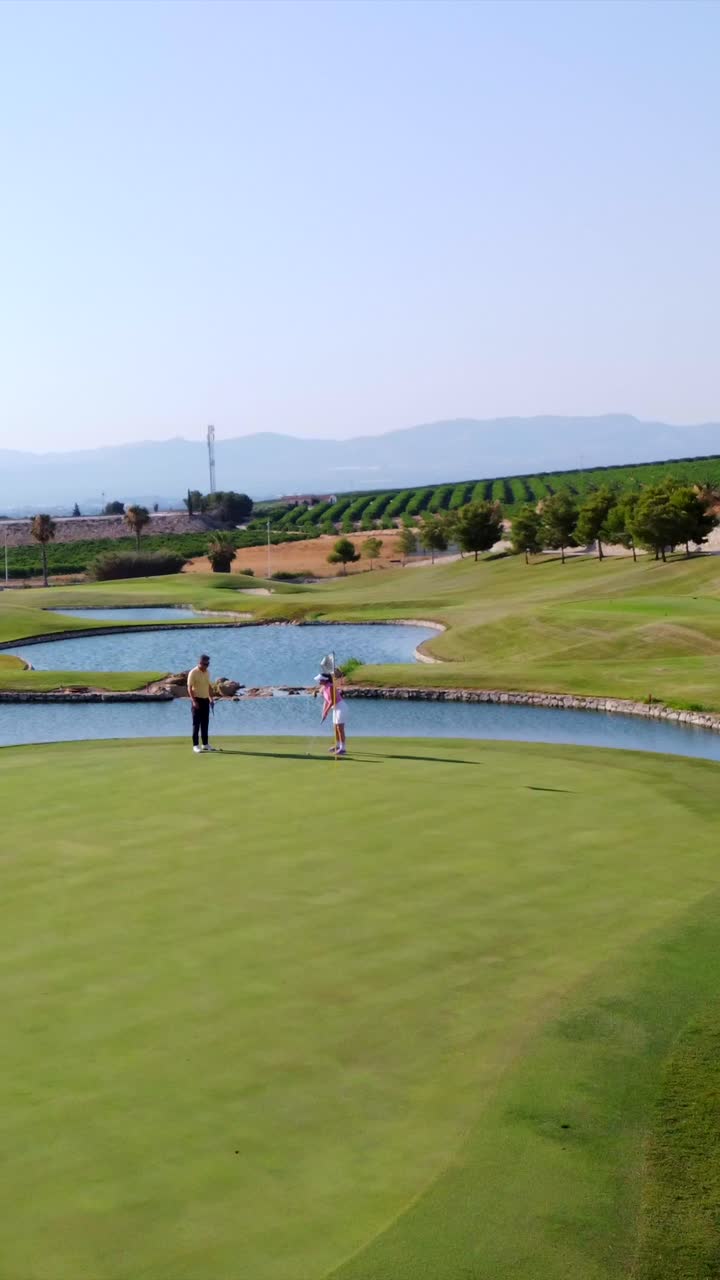 Golf course landscape with people