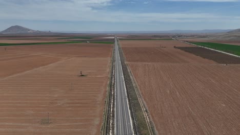 drone-footage-planted-farmland,-cultivated-land-in-the-agricultural-plain