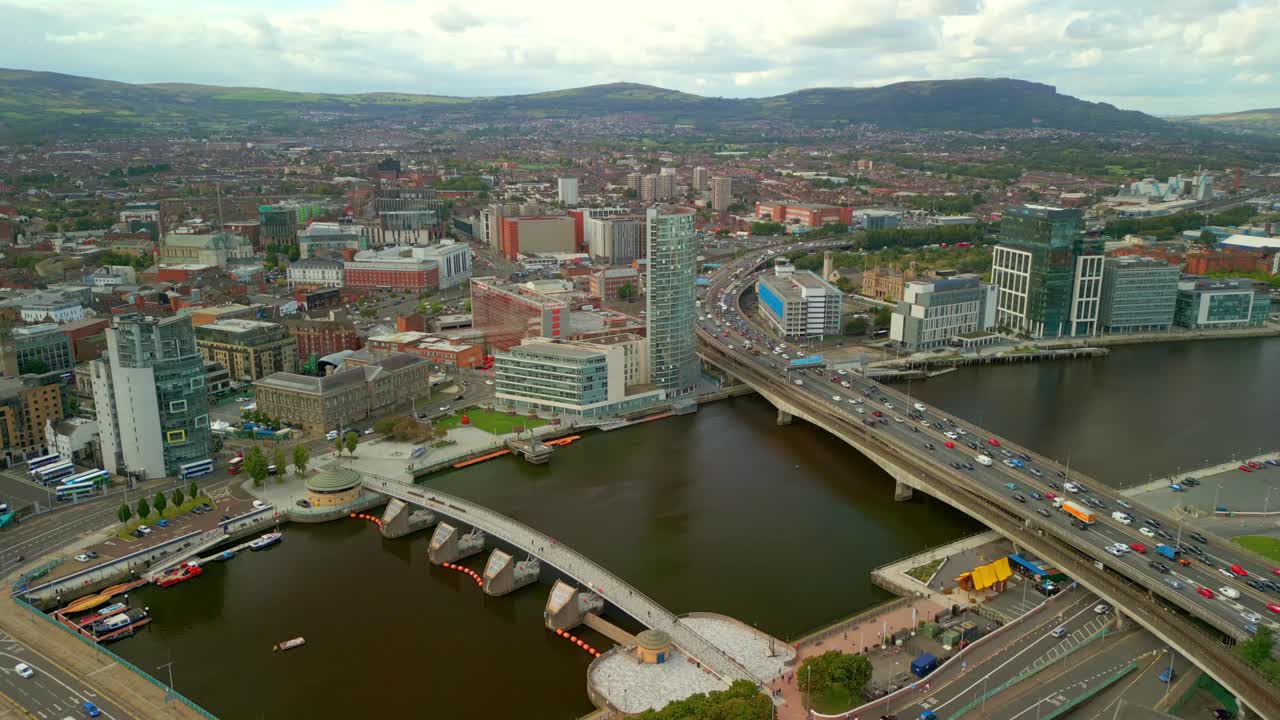 Push-in 4K aerial video of Belfast City centre on a bright and sunny afternoon. Produced in 4K, 60FPS and with Rec709 color