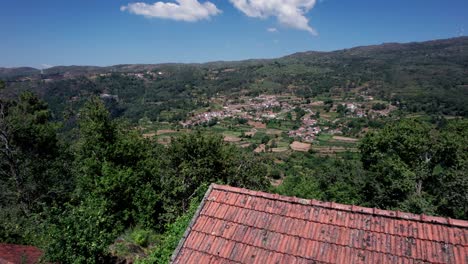 Solitary-cottage-and-village-on-opposite-sides-of-valley,-Portugal