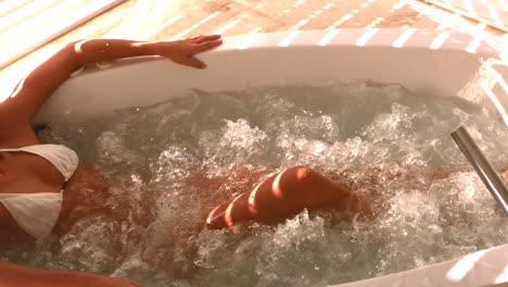 laid down attractive woman in a jacuzzi