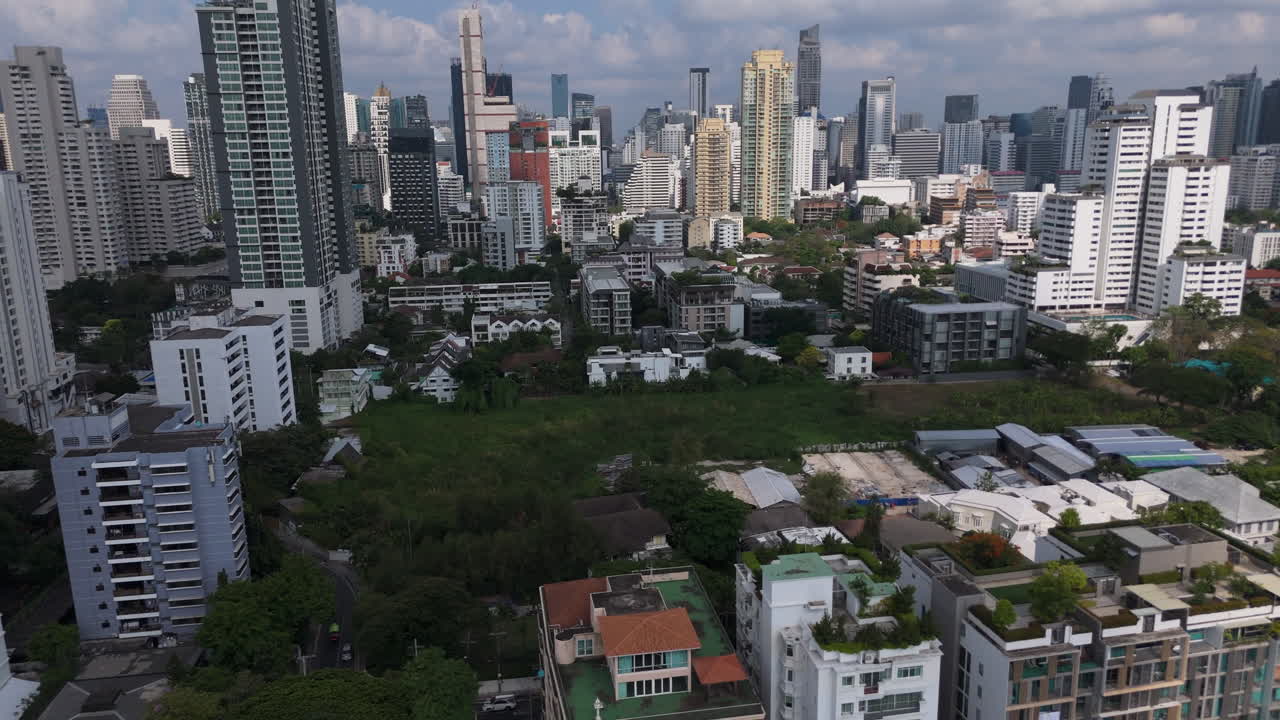 Urban Landscape With Rise Buildings In Phrom Phong Neighborhood In Bangkok, Thailand. Aerial Drone Shot