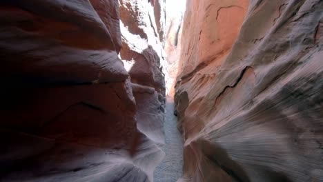 camera moving through a very narrow slot canyon in southern utah.