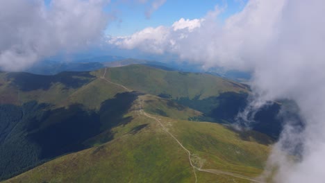 flight over mountains covered with dense forests and thick fog