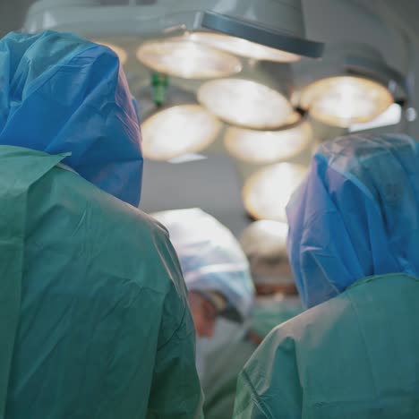 in surgery. specialists in medical uniform are doing an operation in hospital