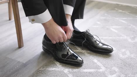 Groom-Tying-his-Dress-Shoe