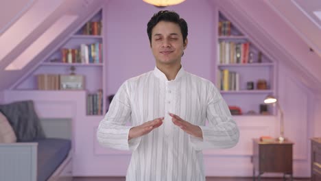 happy indian man doing breathe in breathe out exercise