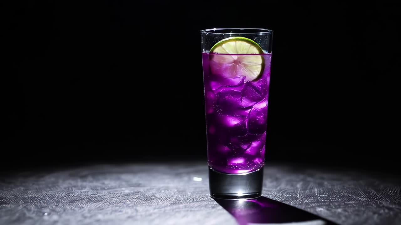 Vibrant Purple Cocktail with Lime and Ice