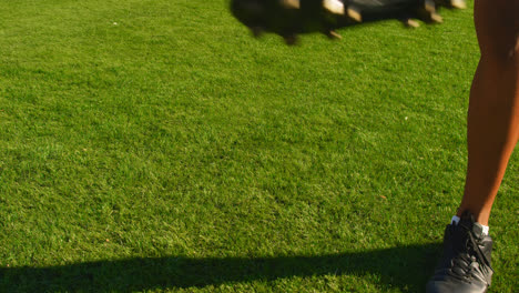 Soccer-player-tossing-the-ball-between-his-legs-4k