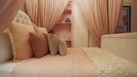 cozy bed with canopy curtains and pillows in luxury boutique bedroom