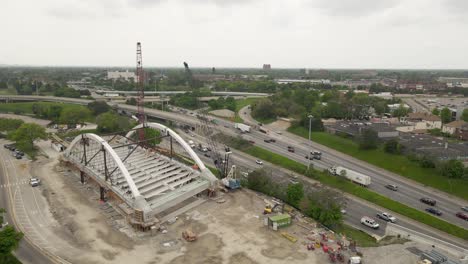 i94 freeway and construction of arch bridge in detroit, aerial drone view