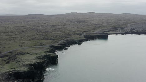 aerial of dark volcanic cliffs at coast of snæfellsnes peninsula in iceland