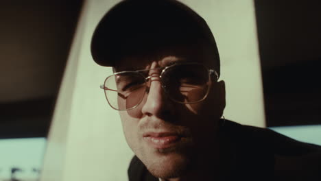 man in baseball cap and sunglasses