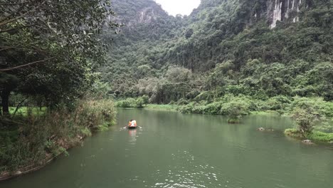 boat gliding on a tranquil green river