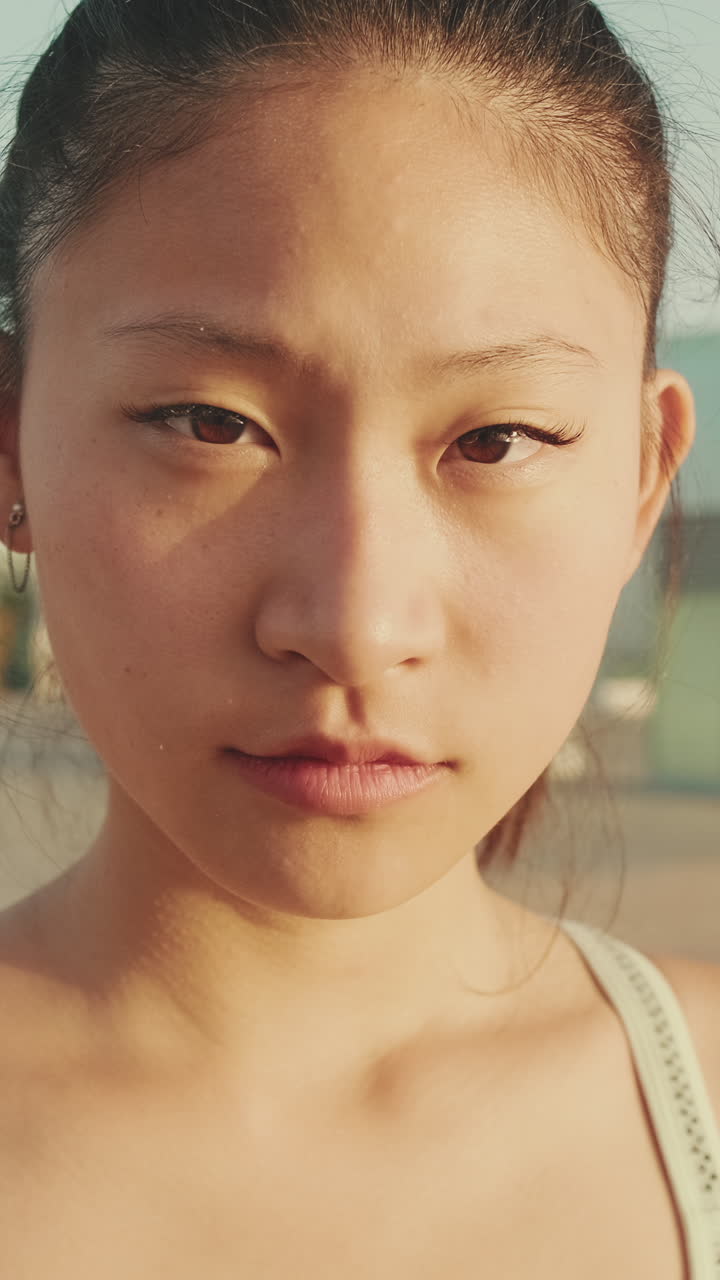 Close-up portrait of a young Asian woman