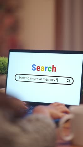 vertical video of woman searching how to improve memory? on internet