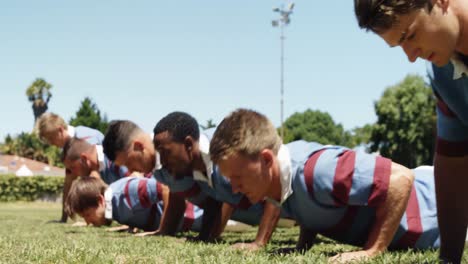 rugby players doing push ups in the field 4k 4k
