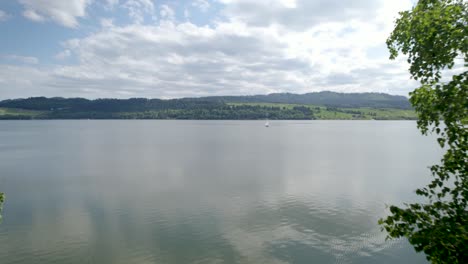 Aerial-Shot-of-Small-Boat-at-the-Lake-on-Sunny-Day