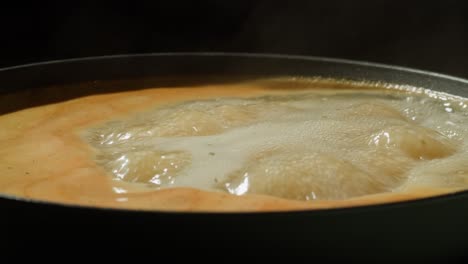 boiling liquid in a pan