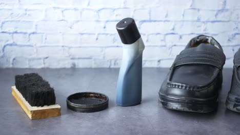 black leather shoes and shoe care products