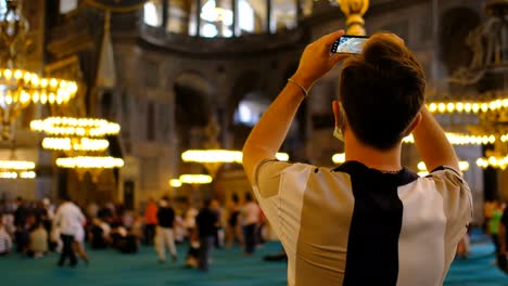 Taking-Pictures-Masked-man-taking-pictures-inside-Hagia-Sophia