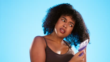 Afro,-knot-and-black-woman-with-comb-for-hair