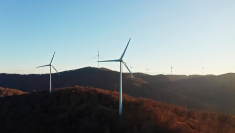 eyesore of rotating wind turbines on top of mountains in savona, italy