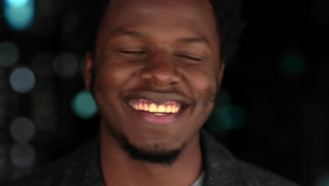 black man, face and beer bottle at night