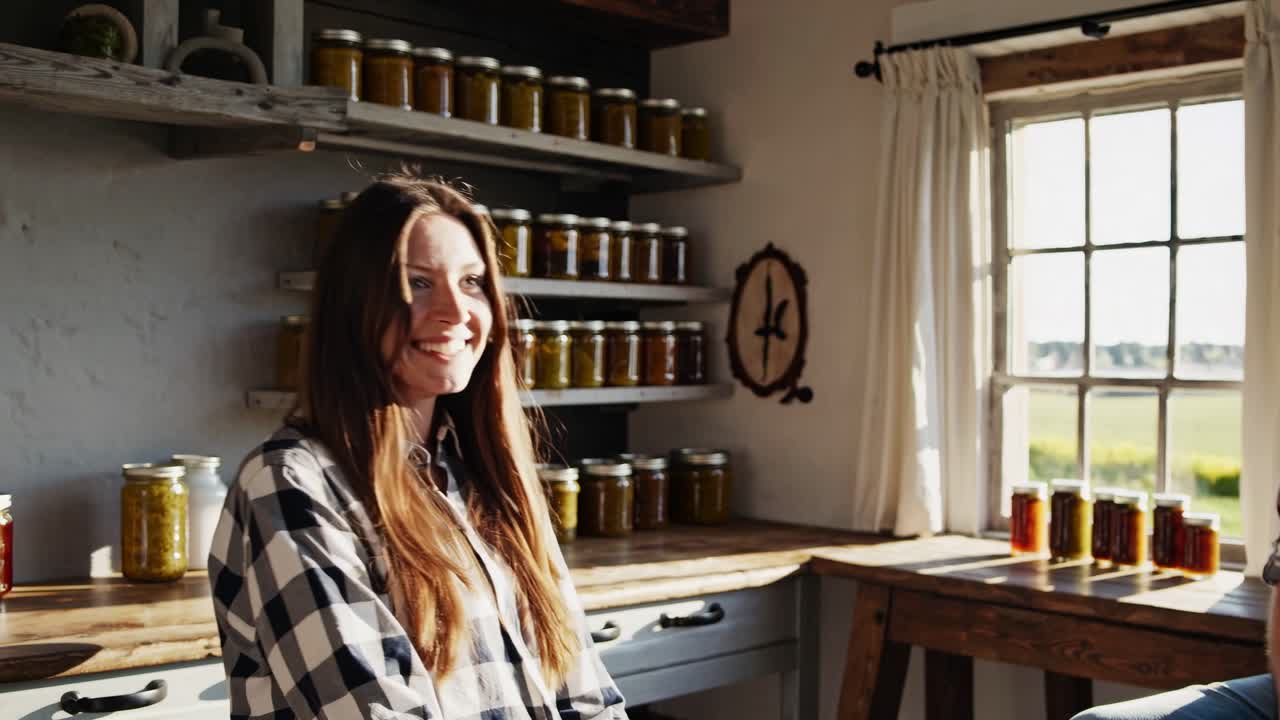 Couple enjoying a sunny afternoon in their rustic kitchen