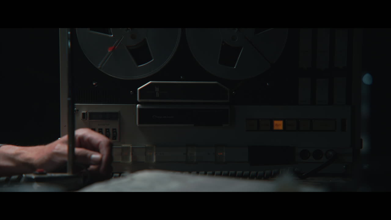 An intelligence officer listens to the wiretap recordings