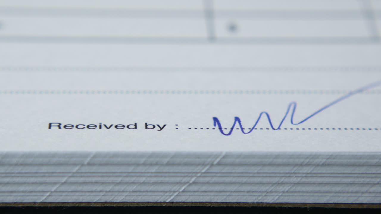 Close up of a signature on a paper form