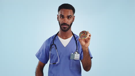 Thumbs-down,-donut-and-advice-with-a-nurse-man