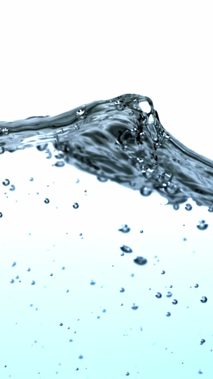 Slow Motion Clear Blue Water Surface with Bubbles and Waves