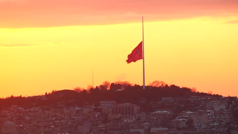 turkish flag at sunset over istanbul