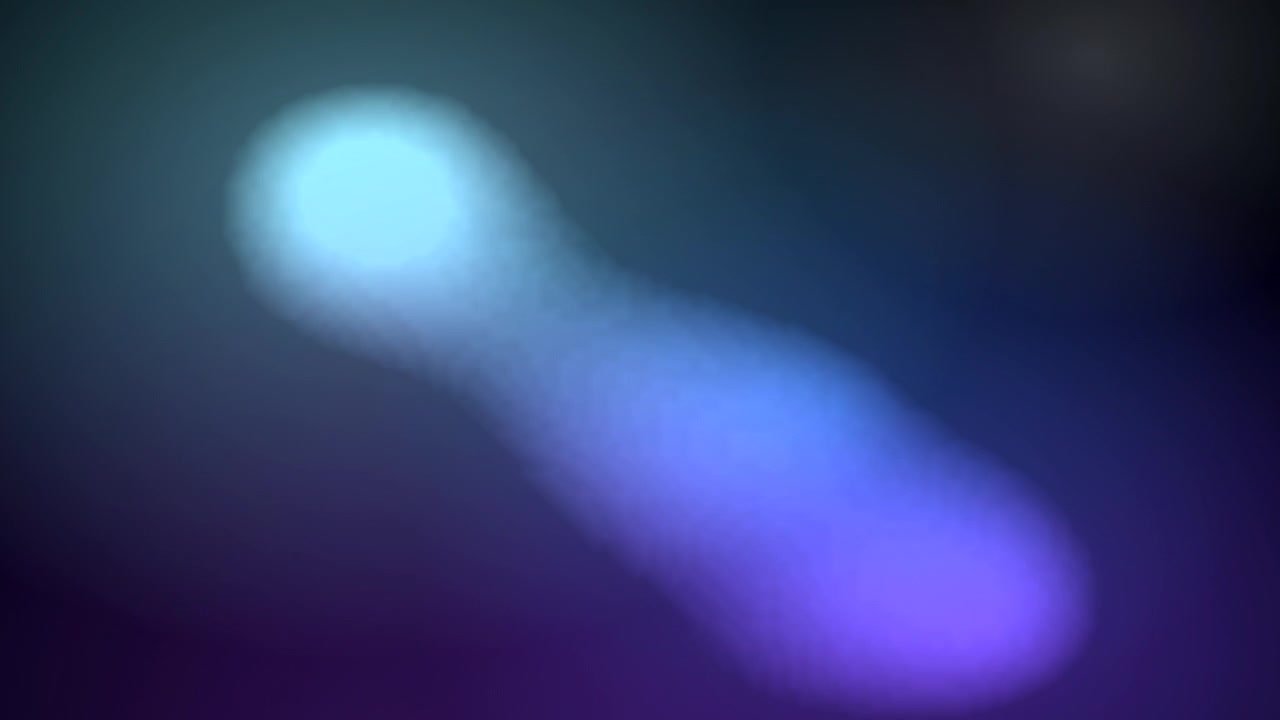 Abstract Motion of Glowing Blue and Purple Light Orbs