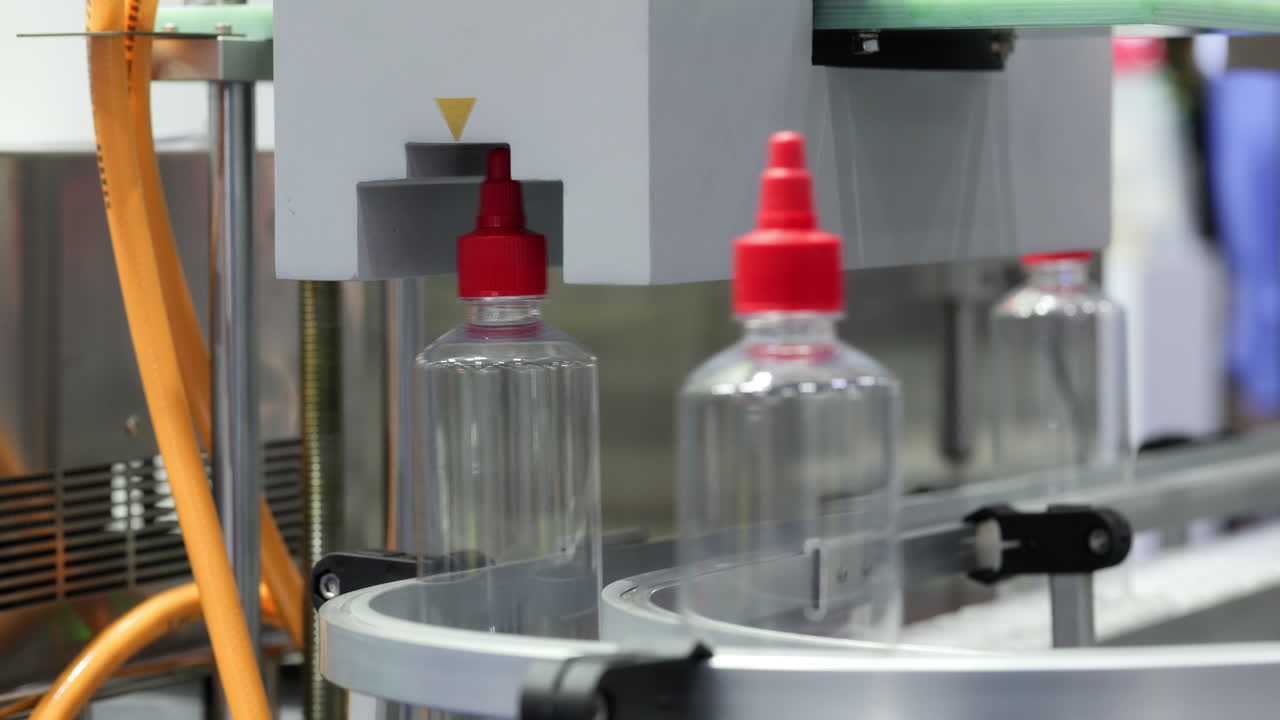 Clear Plastic Bottles Moving on an Automated Production Line